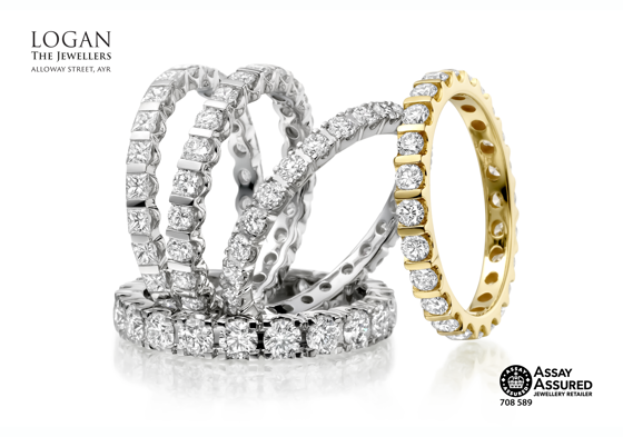 Four white gold and one yellow gold diamond wedding rings